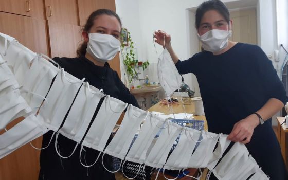 Candidates of Sisters of Mercy of the Holy Cross in Djakovo, Croatia, show a string of masks they have sewn to share with the people in the communities they serve. (Sr. Valerija Široki)