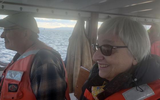 Accompanying GSR correspondent Chris Herlinger on a trip on the Hudson River in mid-November was Sister of Charity Carol De Angelo, right, and John Lipscomb, a boat captain and the vp of advocacy for watchdog group Riverkeeper. 