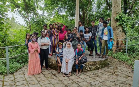 Sr. Soumitha Chittilappilly of the Sisters of the Destitute sits in front with children of Udaya Colony during a field trip in Kochi city in Kerala, India. (Courtesy of Soumitha Chittilappilly)