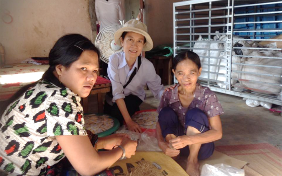 Sr. Agnes Hoang Minh Trang (center) visits two women with visual impairments May 13 in Phu Vang district, in Vietnam. Trang shared her vocation story with young women at Phuong Duc Church on May 8. (Joachim Pham)