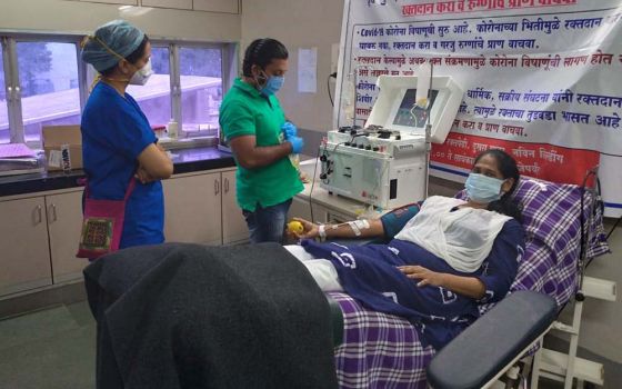 Holy Spirit Sr. Sneha Joseph donates her plasma at the government-managed Nair Hospital in Mumbai, capital of the western Indian state Maharashtra. (Provided photo)