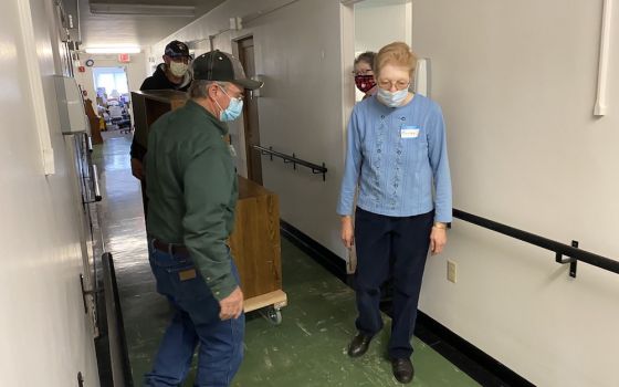 Benedictine Sr. Placida Wemhoff accompanies workers as they move furniture from the residential Annex at the Monastery of St. Gertrude, Cottonwood, Idaho, prior to starting a renovation project in October 2020. (Provided photo)