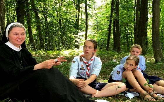 Mahdalyna Nadiya Vytvytska (left) meets with Girl Scouts at a 2020 summer camp session in Ukraine. She serves as assistant chaplain. (Courtesy of Mahdalyna Nadiya Vytvytska)