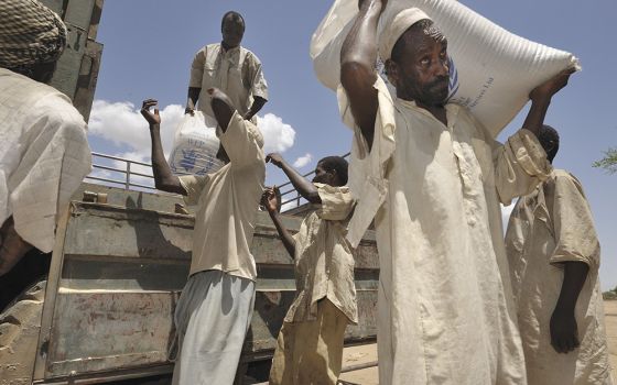 Food provided by the United Nations is unloaded in the Habile Camp for internally displaced Chadians outside the village of Koukou Angarana in Chad, in this 2008 file photo. (CNS/Paul Jeffrey)