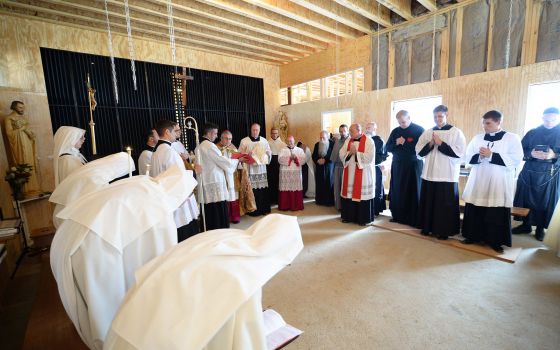 Clergy and Discalced Carmelite nuns gather in the temporary chapel at the Carmelite community July 25, 2018, in Fairfield, Pennsylvania, as Bishop Ronald Gainer of Harrisburg prepares to bless it. The Carmelite monastery in Philadelphia, which has existed