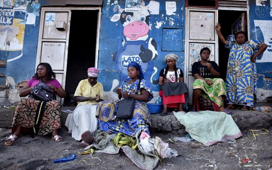 Women sit outside a dwelling amid concerns about the spread of the coronavirus disease March 23, 2020, in Goma, Congo. (CNS/Olivia Acland, Reuters)