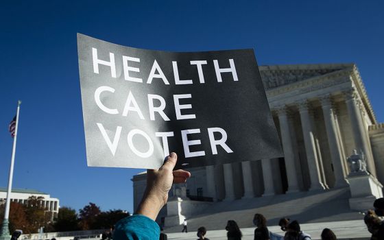 People demonstrate in support of the Affordable Care Act outside the U.S. Supreme Court Nov. 10 in Washington. (CNS/Tyler Orsburn)