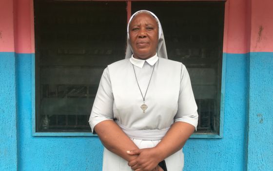 Sr. Matilda Iyang poses outside at the Mother Charles Walker Children Home Oct. 7, at the Handmaids of the Holy Child Jesus convent in Uyo, Nigeria. (CNS/Valentine Iwenwanne)