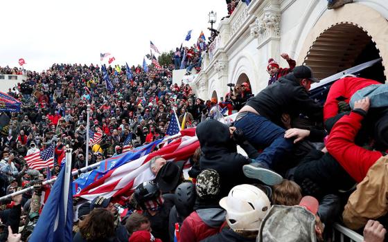 President Donald Trump supporters storm into the U.S. Capitol in Washington Jan. 6 during a rally to contest the certification of the 2020 presidential election. (CNS/Reuters/Shannon Stapleton)
