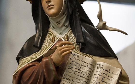 A statue of St. Teresa of Ávila stands in the sanctuary of the Serra Chapel at Mission San Juan Capistrano in San Juan Capistrano, California. (CNS/Nancy Wiechec)