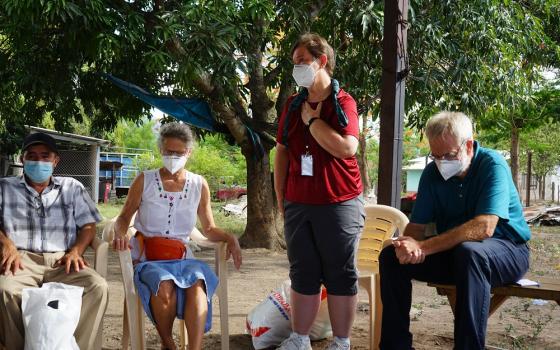 Mercy Sr. Mary Kay Dobrovolny, standing, speaks with a delegation from the U.S. in Honduras in early July. In the solidarity trip, the U.S. visitors learned about conditions that fuel northward migration. (CNS/Courtesy of SHARE)