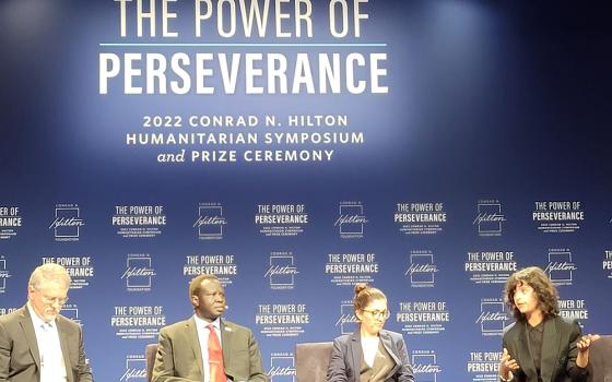 Conrad N. Hilton Foundation president and CEO Peter Laugharn, far left, moderates a panel about refugee resilience. The panel was part of the Oct. 21 Hilton Humanitarian Symposium and Prize Ceremony in Beverly Hills, California. (GSR photo/Gail DeGeorge)