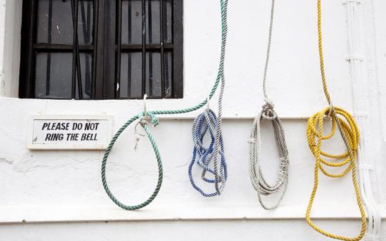 Bell ropes on the wall of a church in India (Dreamstime/Jaume Juncadella)