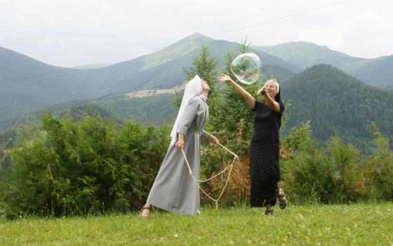 	 1.	Benedictine sisters relax during a meeting in the Ukrainian Carpathian Mountains (Courtesy of Scholastica Oleksandra Hulivata) 