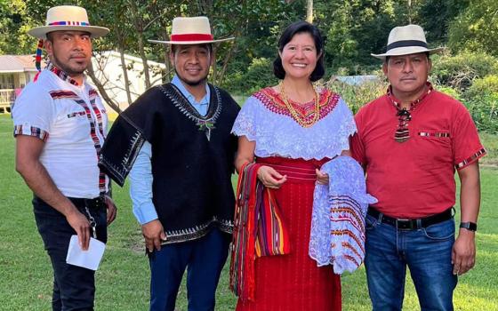 Sr. Gabriela Ramírez of the Guadalupan Missionaries of the Holy Spirit poses for a photo with men of the Mayan community in Birmingham, Alabama (Courtesy of Gabriela Ramírez)