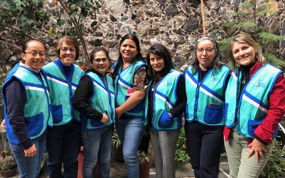 The sisters and their helpers pose in the patio of La Palmita for a photo after a recent abordaje, or outreach session in the streets of La Merced. From left are Novice Sister Isaura, Sr. Manuela Rodríguez, Mariana Gutierrez, Cecilia Martínez, Sr. María Rosas, Sr. Carmen Paz and journalist Tracy Barnett. (Courtesy of Tracy Barnett)