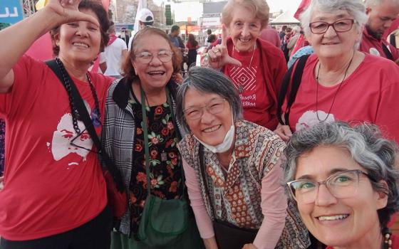 Some sisters of the community of the Carmelites of Charity of Vedruna, in Belo Horizonte, Brazil, meet Nov. 3 to evaluate their actions in the electoral campaign. Red is the color of the Workers' Party — the color of the party that elected Luiz Inácio Lula da Silva president. (Virma Barion)