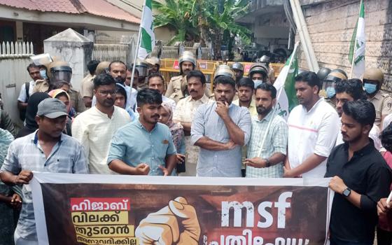 Muslim men protest Sept. 26 in front of Providence Girls Higher Secondary School, Kozhikode, in the southwestern Indian state of Kerala, demanding withdrawal of a ban on wearing the hijab in classrooms. The school is managed by the Apostolic Carmel congregation. (S. Kumar)