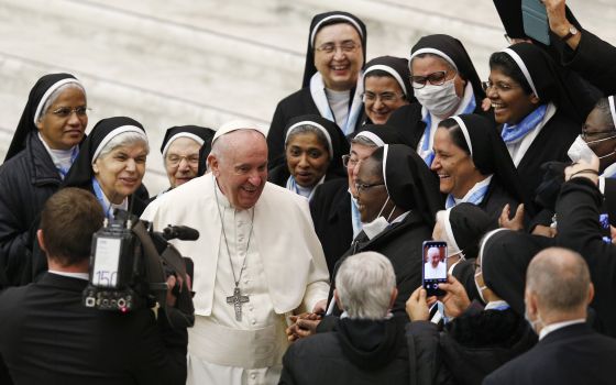 Pope Francis greets nuns during his general audience in the Paul VI hall at the Vatican Jan. 5. Francis has said women religious play an essential role in the synodal process. (CNS photo/Paul Haring)