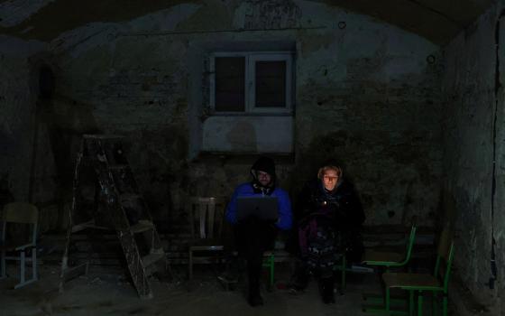 People in Lviv, Ukraine, take shelter in the basement of a school March 3 amid Russia's invasion of Ukraine. (CNS/Reuters/Kai Pfaffenbach)