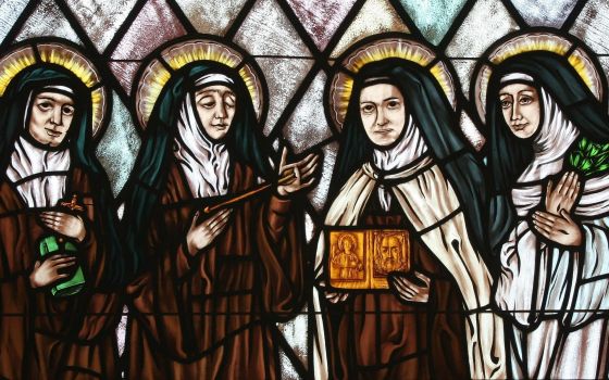 Sts. Edith Stein, Teresa of Ávila, Therese of Lisieux and Catherine of Siena are represented in stained glass at St. Thérèse of Lisieux Church in Montauk, N.Y. (CNS photo/Gregory A. Shemitz, Long Island Catholic)