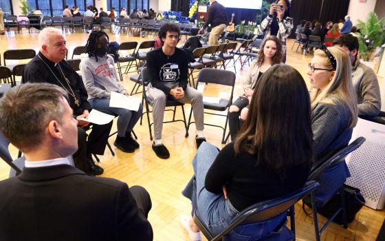 Philadelphia Archbishop Nelson Pérez joins college students, other young adults and ministry leaders during an April 4 synodal listening session at La Salle University. (CNS/CatholicPhilly.com/Sarah Webb)