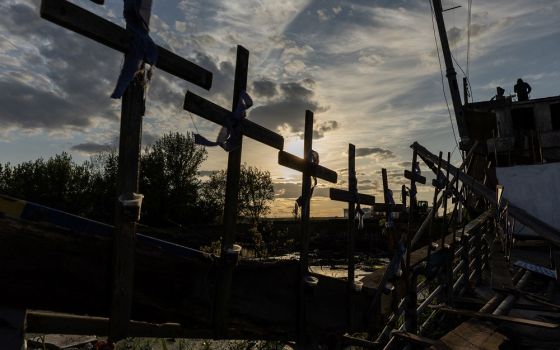 Crosses attached to a destroyed bridge in Irpin, Ukraine, on May 16 (CNS/Reuters/Jorge Silva)
