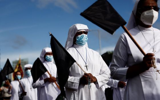 Women religious march with black flags during a May 28 protest in Colombo, Sri Lanka, demanding that President Gotabaya Rajapaksa step down amid the country's economic crisis. (CNS/Reuters/Dinuka Liyanawatte)