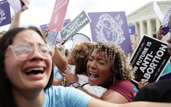 Pro-life demonstrators in Washington celebrate outside the Supreme Court June 24 as the court overruled the landmark Roe v. Wade abortion decision in its ruling in the Dobbs case on a Mississippi law banning most abortions after 15 weeks. (CNS/Reuters/Eve