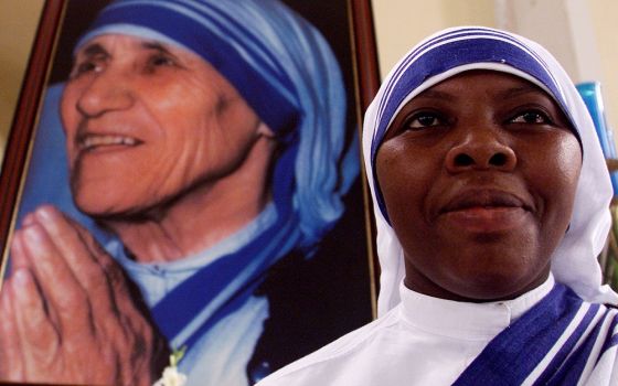 A member of the Missionaries of Charity is pictured in a file photo near an image of St. Teresa of Kolkata during Mass at the cathedral in Managua, Nicaragua. The religious order has been expelled from Nicaragua. (CNS/Reuters/Oswaldo Rivas)