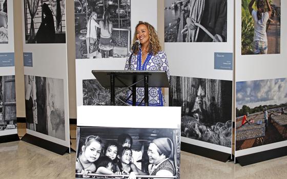 Photographer Lisa Kristine speaks at the July 29, 2019, opening of the "Nuns Healing Hearts" photo exhibition at the United Nations. (CNS/Gregory A. Shemitz)