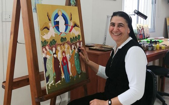 Melkite Sr. Souraya Herro poses with some of her artwork Sept. 7 in her workshop at the convent of Our Lady of the Annunciation in Zouk Mosbeh, Lebanon. (CNS/Doreen Abi Raad)