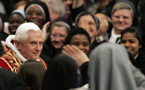 Pope Benedict XVI greets nuns as he arrives for a special Mass for consecrated men and women Feb. 2, 2007, in St. Peter's Basilica at the Vatican. (CNS/Reuters/Dario Pignatelli)