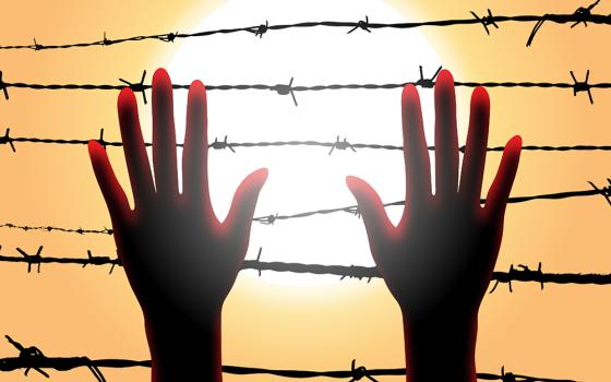 A women's hands reaching up to barbed wire (Pixabay/Zaid Pro)