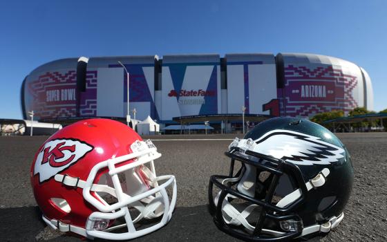 The helmets of the Kansas City Chiefs and Philadelphia Eagles are pictured outside State Farm Stadium in Glendale, Arizona