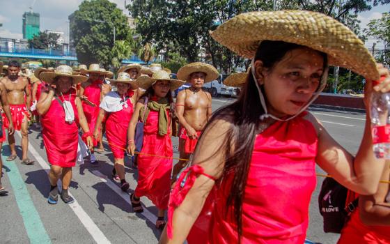 About 300 Indigenous people march Feb. 23 in Quezon City, Philippines, during a nine-day march to protest the construction of the Kaliwa Dam in their ancestral domain in the Sierra Madre mountain range. (Newscom/Sipa USA/Pacific Press/Edd Castro) 