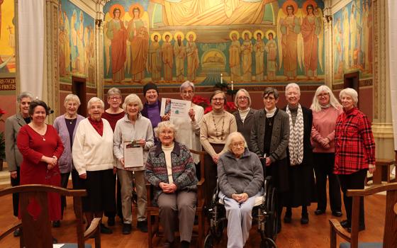 Chicago Benedictine sisters pose with their certificate for taking the Refuse to Use pledge, a challenge for Catholic Sisters Week to not use single-use plastic bottles. (Courtesy of Catholic Sisters Week)