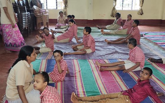 Children practice yoga at Manasa Rehabilitation and Training Centre, a laity-initiated school for children with intellectual disabilities in Pamboor, near Udupi, Karnataka state in India. (Thomas Scaria)