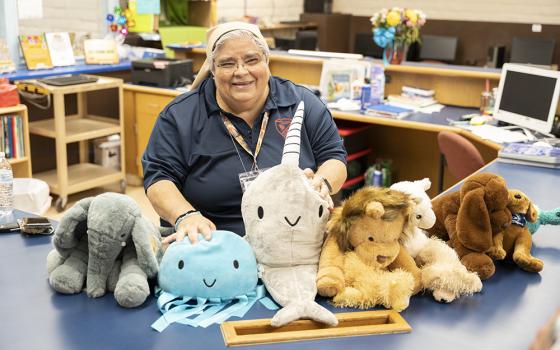 Teresian Sr. Mary Lou Aldape shows off her stuffed animals in the library at Sacred Heart Catholic School in Uvalde, Texas, in August 2022. (OSV News/Courtesy of Catholic Extension/Juan Guajardo)