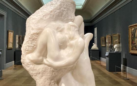 White marble sculpture The Hand of God by Rodin