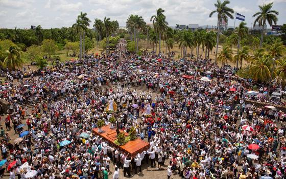 People gather for a Good Friday procession outside the Metropolitan Cathedral as the government banned Holy Week street processions this year due to unspecified security concerns, April 7 in Managua, Nicaragua. Parishes in Nicaragua conducted traditional Viacrucis processions on church grounds or inside churches. (OSV News/Reuters)