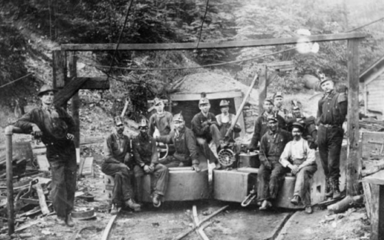 Coal miners are pictured at the entrance to the Richard Mine, owned by the Elkins Coal and Coke Company in Deckers Creek, West Virginia, in this 1976 photograph. (Library of Congress/Historic American Engineering Record)