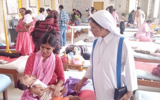 Sr. Mary Rina Magdeline Cruze looks after patients at Kumudini Hospital in Tangail, Bangladesh, in March. (Sumon Corraya)