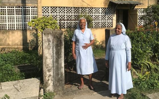 Salvatorian Srs. Rani Fernando, left, and Selvarani Fernando (no relation) stand outside their apartment in Don Boscopura, a tsunami rehabilitation enclave in Negombo, Sri Lanka. (Thomas Scaria)