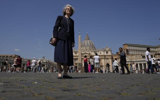 Sr. Nathalie Becquart, the first female undersecretary in the Vatican's Synod of Bishops, poses for a photo in front of St. Peter's Square May 29. Becquart is charting the global church through an unprecedented, and even stormy, period of reform as one of the highest-ranking women at the Vatican. (AP/Alessandra Tarantino)
