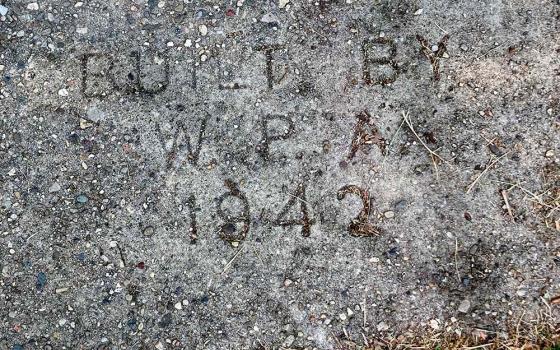 A stamp on the sidewalk near Sr. Emily TeKolste's neighborhood in Terre Haute, Indiana, reads "Built by W.P.A. 1942." (Courtesy of Emily TeKolste)