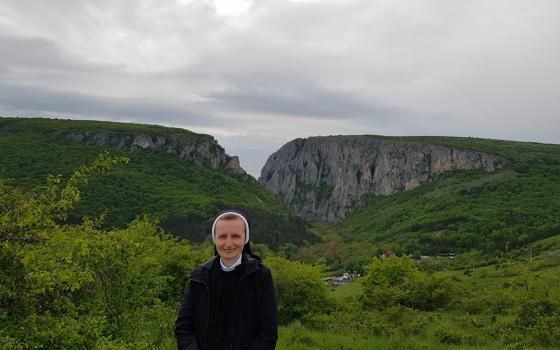 Sr. Teodozija Myroslava Mostepaniuk is pictured in a photo taken in May at Cheile Turzii ("The Keys of Turda") canyon in Romania. (Courtesy of the Sisters of the Order of St. Basil the Great)