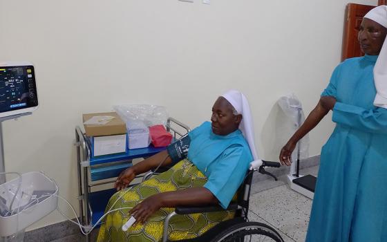 Good Samaritan Sisters Rose, left, and Batulumawo are examined at St. Veronica Medical Centre in Ttomi Buloba, Uganda. (Courtesy of the Sisters of the Good Samaritan)