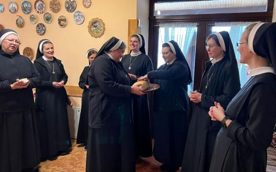 Basilian Sisters in Ukraine share bread they baked together. The author compares intercultural life in women's religious communities to the process of baking bread as ingredients come together in their diversity. (Courtesy of Yeremiya Steblyna)