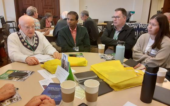 Attendees of the annual assembly of the Association of U.S. Catholic Priests discuss their ministry in the context of synodality during a table discussion on June 14 at the University of San Diego. (Dennis Sadowski)